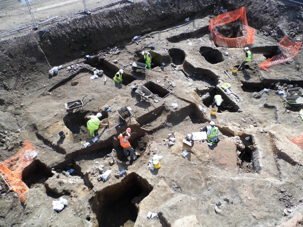 Archaeologists excavate large areas of medieval and post-medieval pitting in the backyards of properties running along Southgates.